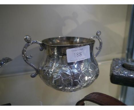 An early Charles II silver twin-handled  porringer, maker IG, London 1666, of  baluster form, repousse with a band of flowers