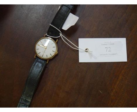 A vintage Omega gentleman's yellow metal wristwatch, with baton numerals, automatic movement, on a leather strap. 