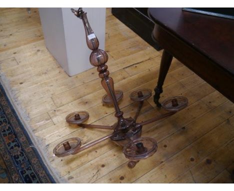 A 20th century Venetian amethyst glass six-light chandelier, the baluster stem issuing straight reeded candle arms terminatin