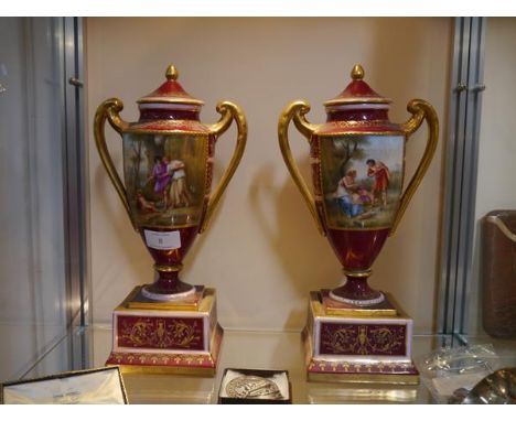 A pair of Vienna Porcelain urns and covers, late 19th century, each painted with the figure of Cupid  and Classical figures a