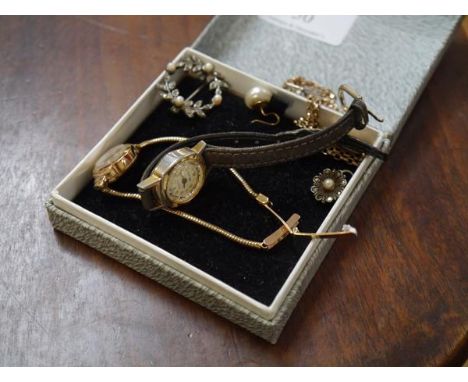 A Rotary lady's 9ct gold cased wristwatch on a 9ct gold snakelink strap; together with a 9ct gold locket on a 9ct gold chain;