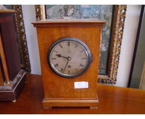 A  1920's oak cased mantel clock, for the Admiralty, the silvered dial with Roman numerals and Royal monogram GR, the movemen