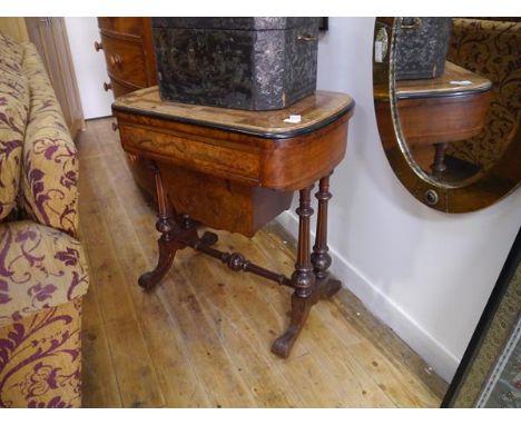 A mid-Victorian inlaid walnut games and work table, the moulded edge top with rounded ends and ebonised band and inlaid in bu