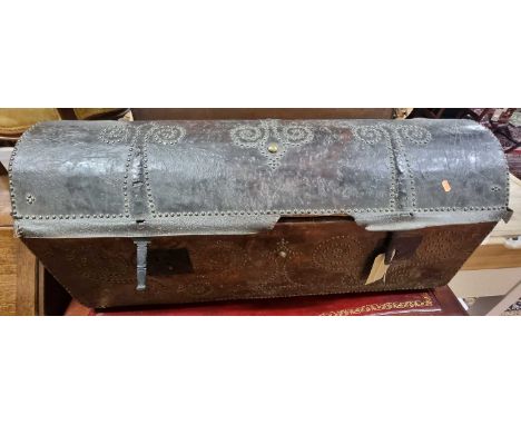 An 18th century Continental tan leather clad and brass studded domed long travelling trunk, having iron lock plates and confo