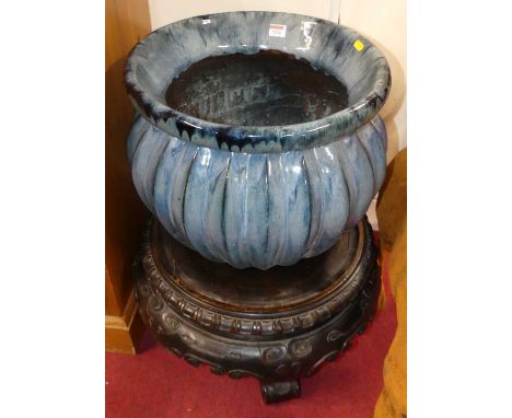 *A large stoneware turquoise drip-glazed planter, h.38cm, dia.45cm; together with an early 20th century Chinese ebonised and 