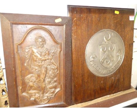 A carved walnut allegorical panel, 33 x 18.5cm, in oak frame, circa 1900; together with an embossed metal armorial panel moun