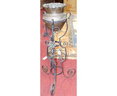 An early 20th century scroll wrought iron jardiniere stand, with copper inset planter, overall height 87.5cm