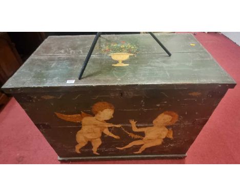 A 19th century Swedish painted planked pine hinge top travelling trunk, decorated with winged putti and urn of flowers with i