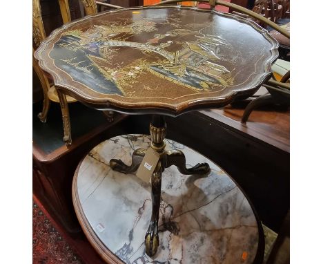 A mahgoany and Japan gilt lacquered piecrust tilt-top pedestal tripod table, depicting typical figure landscape scene with bu