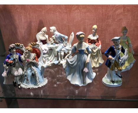 Collection of six ceramic figurines, two with seated couples, some with makers marks to base, possibly German