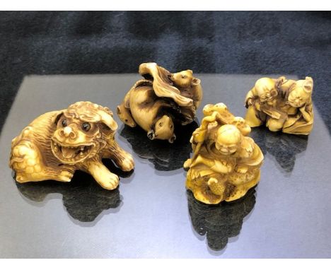 Four Japanese Netsuke one signed 