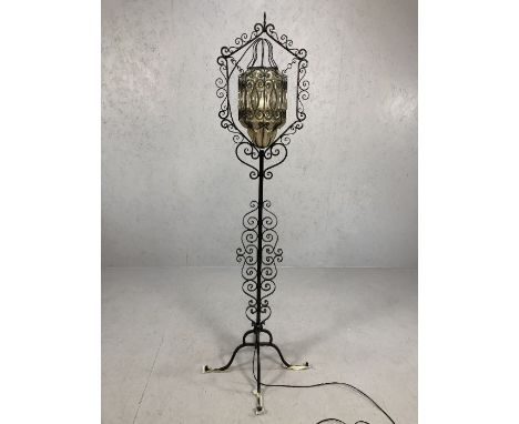 Wrought iron standard lamp with glass suspended shade approx 180cm in height
