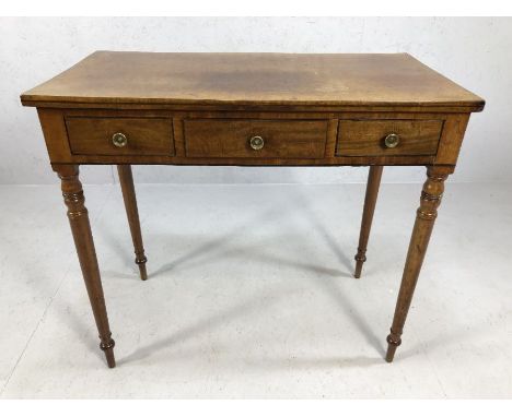 Console table with turned tapering legs, three drawers, with brass handles, approx 90cm x 49cm x 81cm tall