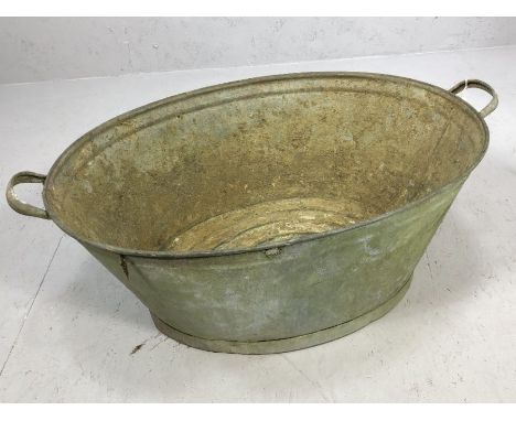 Galvanised twin handled bath tub, soon to be garden planter