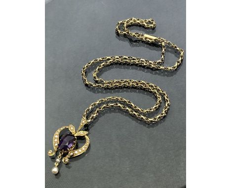 9ct Gold chain (8.5g) with unmarked gold coloured heart shaped pendant set with seed pearls (3.5g)