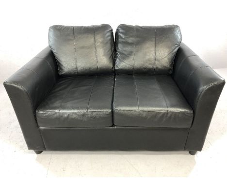 Small black leather two-seater sofa, approx 130cm in length