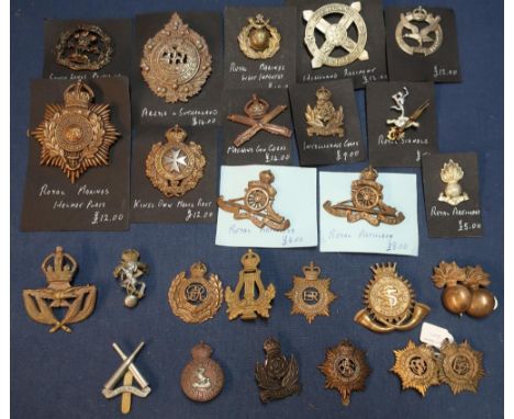 Selection  of various military cap badges including Highland Regiment, Kings Own Malta Regiment, Royal Marines helmet plate, 