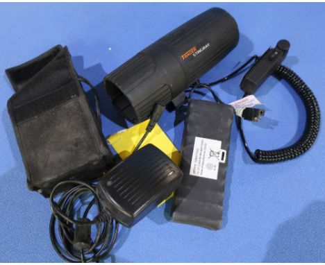 Box containing a Tracer Stingray lamp with spare batteries and charger 