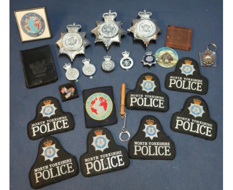 Collection of various staybright and other police helmet badges etc, including North Yorkshire Police, a New Zealand Police S