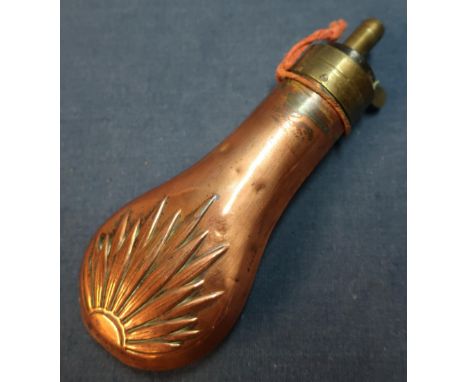 Copper and brass pistol flask with sunburst design (height 13cm) 