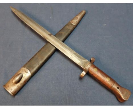 Wilkinson of London double edged bayonet with 12 inch blade and two piece wooden grips, the blade marked 402 Wilkinson London