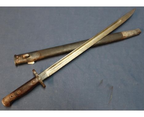 British rifle bayonet with 17 inch blade, with various stamp marks including Wilkinson 1907, complete with leather sheath 