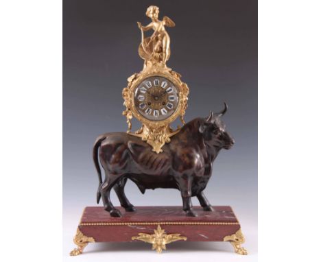 AN IMPRESSIVE LATE 19TH CENTURY FRENCH ORMOLU AND PATINATED BRONZE BULL MANTEL CLOCK the bull standing on a rouge marble base