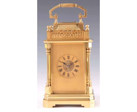 A LARGE LATE 19TH CENTURY FRENCH BRASS REPEATING CARRIAGE CLOCK having a pagoda top with pierced gallery supported on four ca