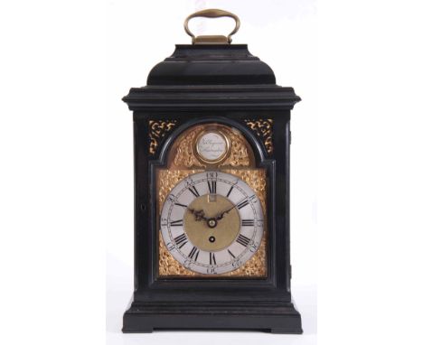 JOHN RAYMENT, HUNTINGDON. A GEORGE II EBONISED INVERTED BELL TOP BRACKET CLOCK the case surmounted by a brass carrying handle