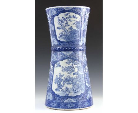 A 19TH CENTURY CHINESE BLUE AND WHITE STICK STAND decorated with Chrysanthemums and panels depicting garden scenes and branch