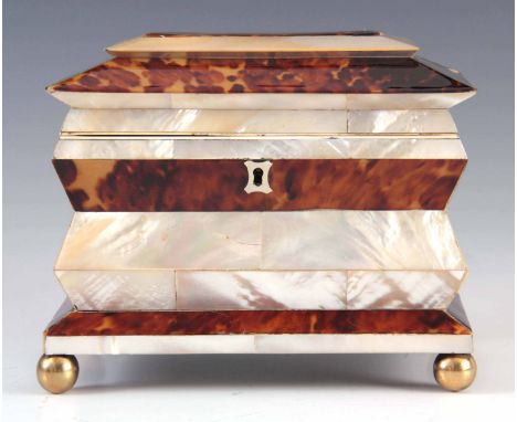 AN UNUSUAL SHAPED EARLY 19TH CENTURY TORTOISESHELL AND MOTHER OF PEARL TEA CADDY of sarcophagus form with hinged lid revealin