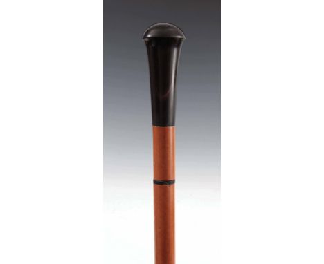 AN EARLY 20th CENTURY GENTLEMANS HORN HANDLED MALACCA SWORD STICK having a 68cm steel tapering blade with etched decoration s
