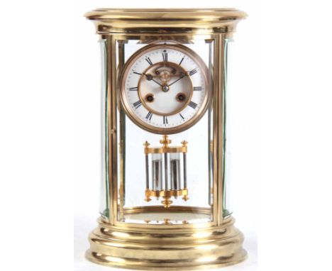 A LATE 19TH CENTURY FRENCH OVAL FOUR-GLASS MANTEL CLOCK the lacquered brass moulded case inset with four bowed bevelled glass