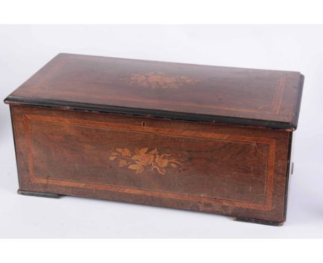 A 19TH CENTURY MUSICAL BOX MADE FOR THE CHINESE EXPORT MARKET the rosewood case with marquetry inlaid panels, enclosing a mus