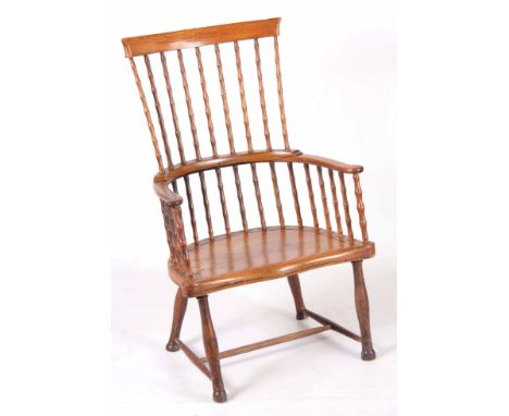 A 19TH CENTURY SCOTTISH ASH AND WALNUT COMB BACK WINDSOR CHAIR possibly from Ayrshire with dished top rail supported by faux 