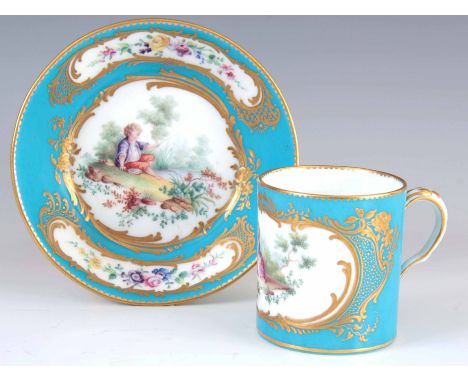 A FINE LATE 18TH /19TH CENTURY SEVRES PORCELAIN  CUP AND SAUCER on a gilded celestial blue ground with painted panels of chil
