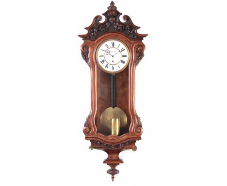 W. SCHÖNBERGER, VIENNA. A MID 19TH CENTURY DWARF VIENNA REGULATOR WALL CLOCK the walnut case having a foliate carved pediment