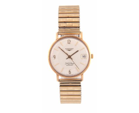 A GENTLEMAN'S 1960's 9CT GOLD LONGINES FLAGSHIP AUTOMATIC WRIST WATCH on a goldplated bracelet, the circular case with slim b