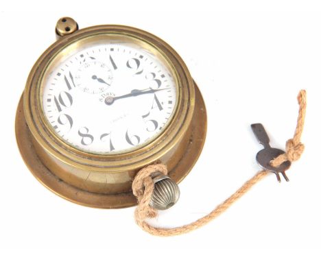 AN EARLY 20TH CENTURY DOXA CAR CLOCK having a brass detachable case with original locking key enclosing a 2.5" enamel Arabic 