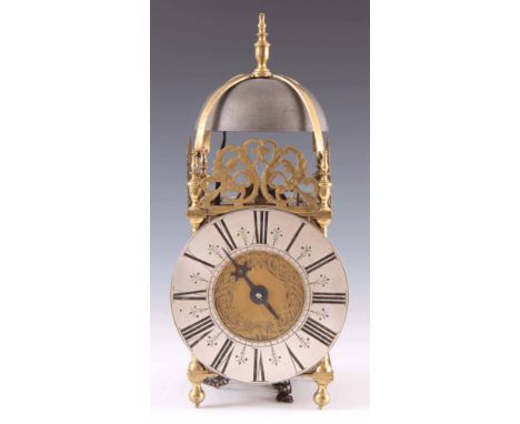 A LATE 17TH CENTURY ENGLISH LANTERN CLOCK of typical form having a large cast iron bell supported on brass straps above a 7" 