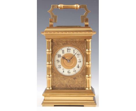 A LARGE LATE 19TH CENTURY FRENCH STRIKING CARRIAGE CLOCK the brass case with scalloped edge moulded top on simulated bamboo c