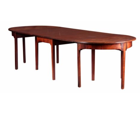 A GEORGE III FIGURED MAHOGANY D END DINING TABLE with three sections comprising of two D ends and a drop down gate leg centre