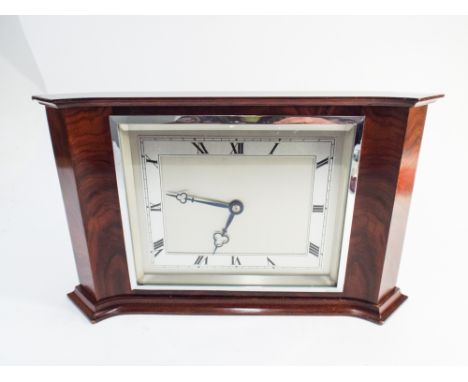 1930's art deco mantel clock in walnut case , retailed by Garrard with rectangular silvered dial 7.5" high x 12" wide 