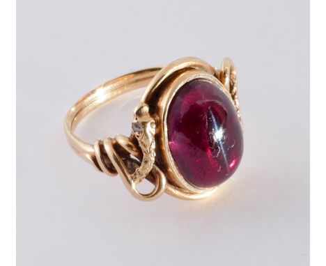 Victorian cabochon garnet set ring, with snake design setting with small rose cut diamond eyes. Ring size O. Closed back sett