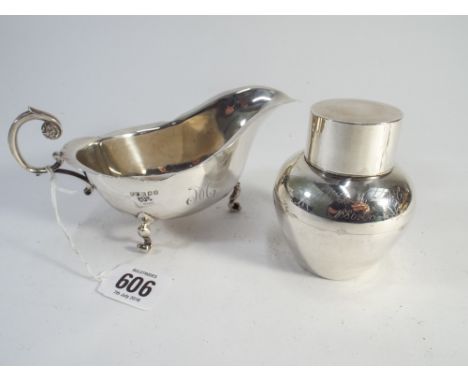 Edwardian silver sauce boat and a silver tea caddy, tea caddy marks London 1911. Gross weight 6.45 troy oz.