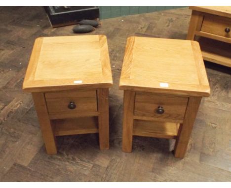 Pair of light oak lamp or bedside tables each with one fitted drawer