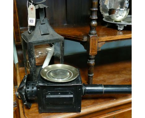 Old black and glass metal lantern and a black painted carriage lamp 