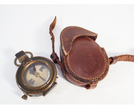 Brass military compass with original brown leather carry case