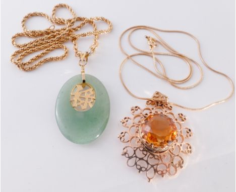 Citrine pendant with gold surround and a jade pendant with inset character mark, both on gold plated chains