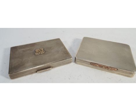 Two silver engine turned cigarette cases, with gold highlights. Gross weight 6.75 troy oz 